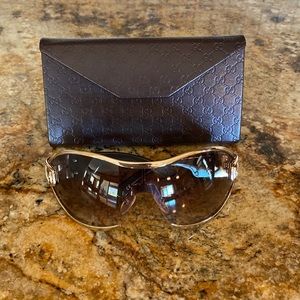 Gucci gold rimmed buckle shield sunglasses